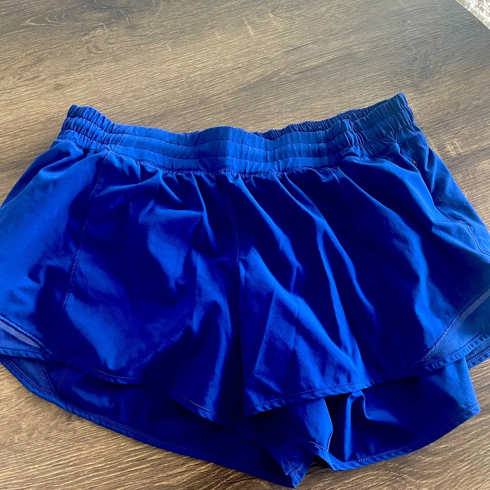 Worn a few times Blue lulululemon hottie shorts inseam 4 inch size 14 tall.